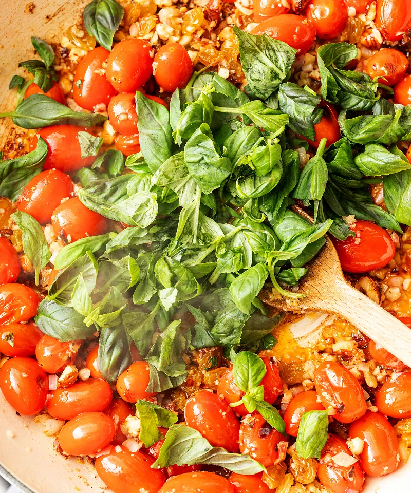 Add basil to tomatoes