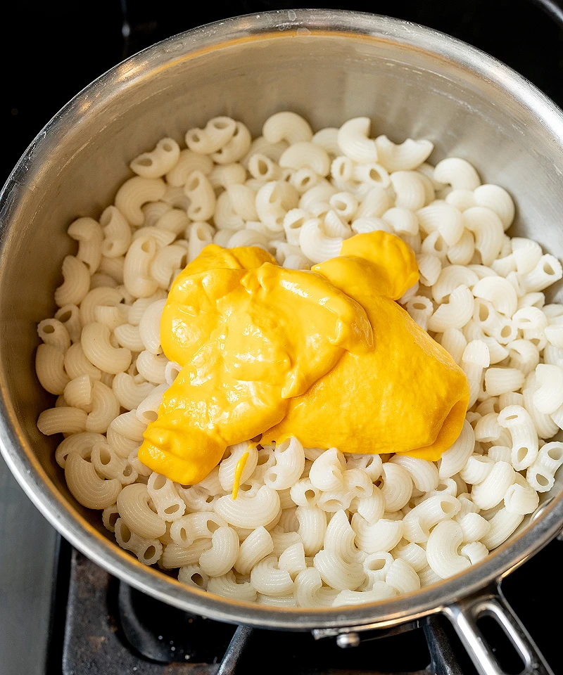 Add dairy free cheese sauce