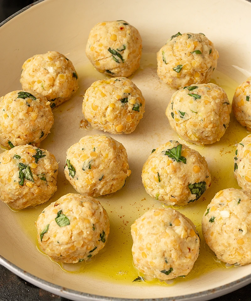 Add red lentil balls to skillet